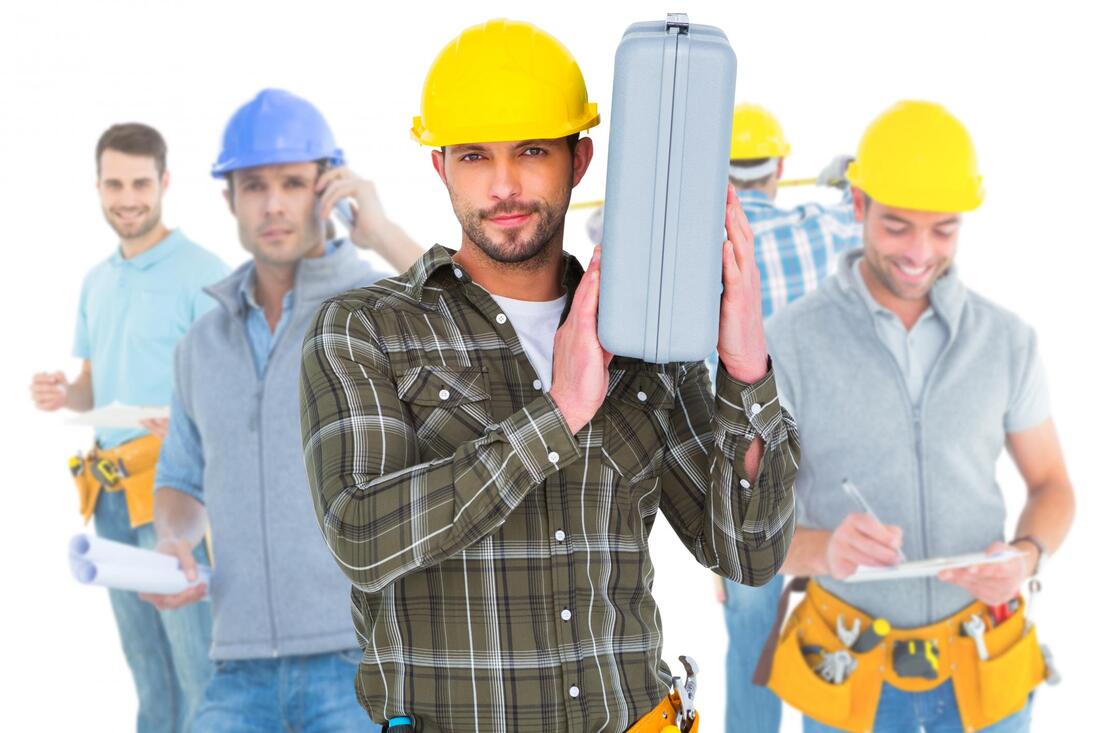 professional construction workers standing posing together 